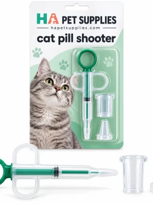 Cat pill shooter syringe with green handle and accessories
