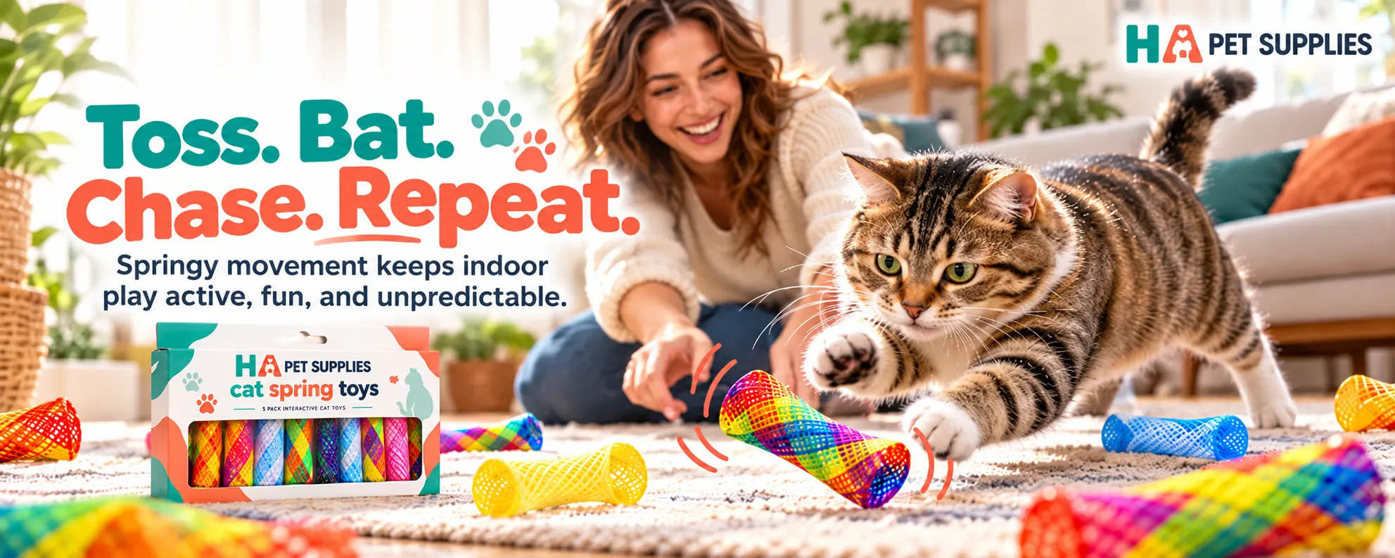 Tabby cat chasing bouncing spring toy indoors